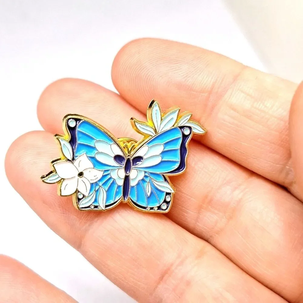 BLUE and white floral butterfly pin